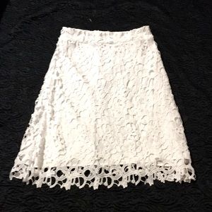 This sassy white calf length, lace over lay skirt, is definitely a must have!!!